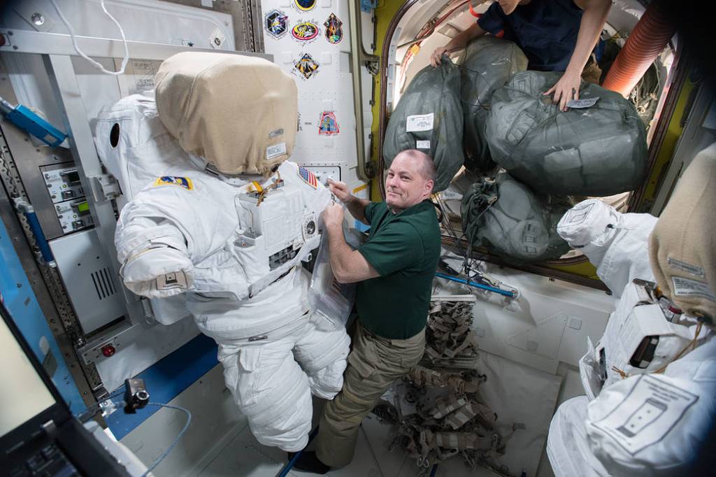 Astronaut Scott Tingle Works on a U.S. Spacesuit
