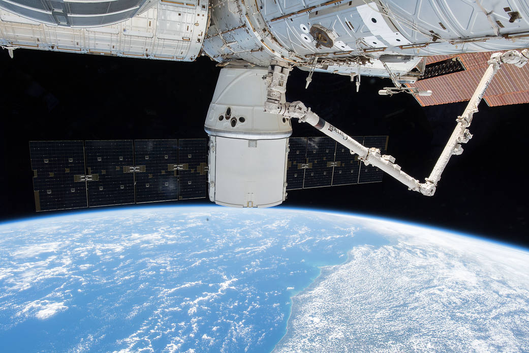 The SpaceX Dragon and the International Space Station Orbit Above Brazil