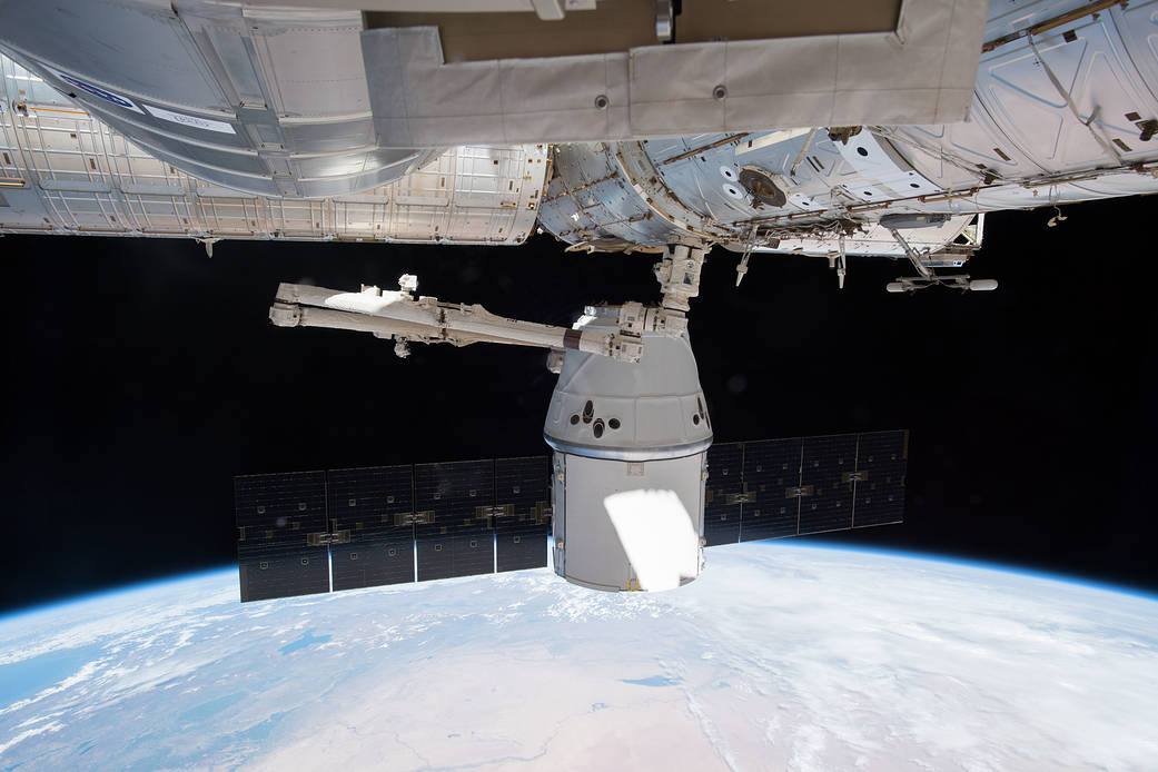 Robotic Arm Maneuvers Dragon Resupply Ship Toward Harmony Module