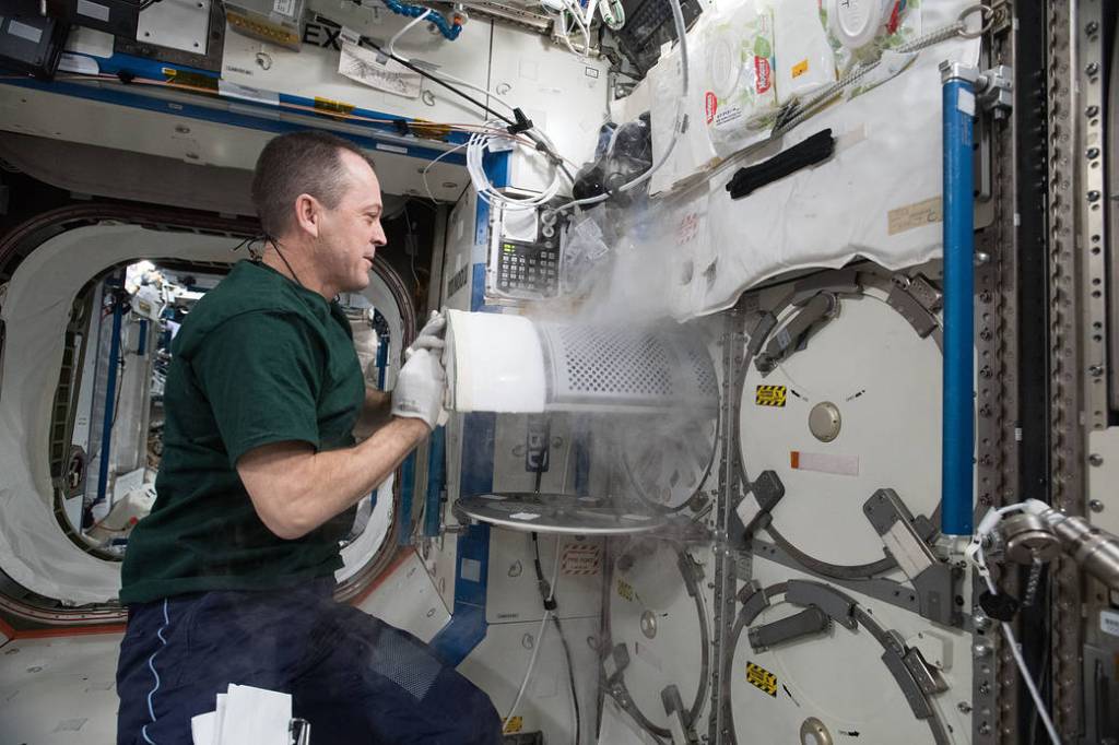 Astronaut Ricky Arnold Transfers Frozen Biological Samples