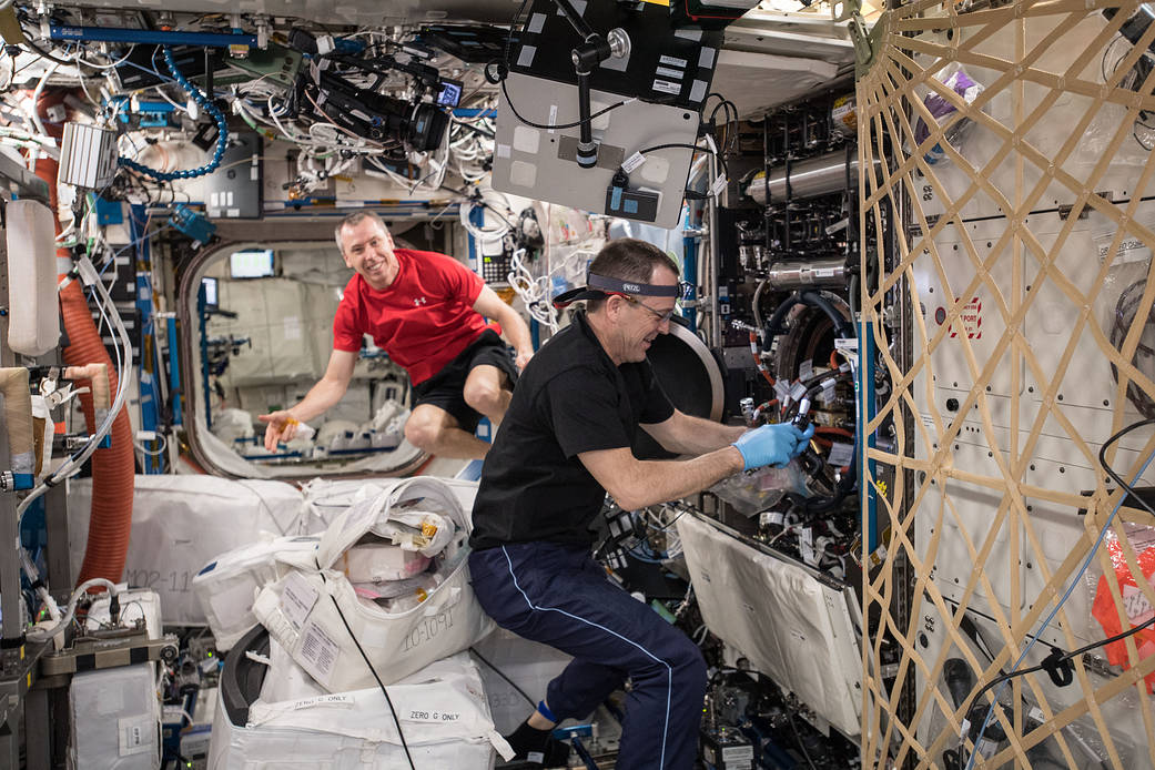 Ricky Arnold performs maintenance inside the Combustion Integrated Rack