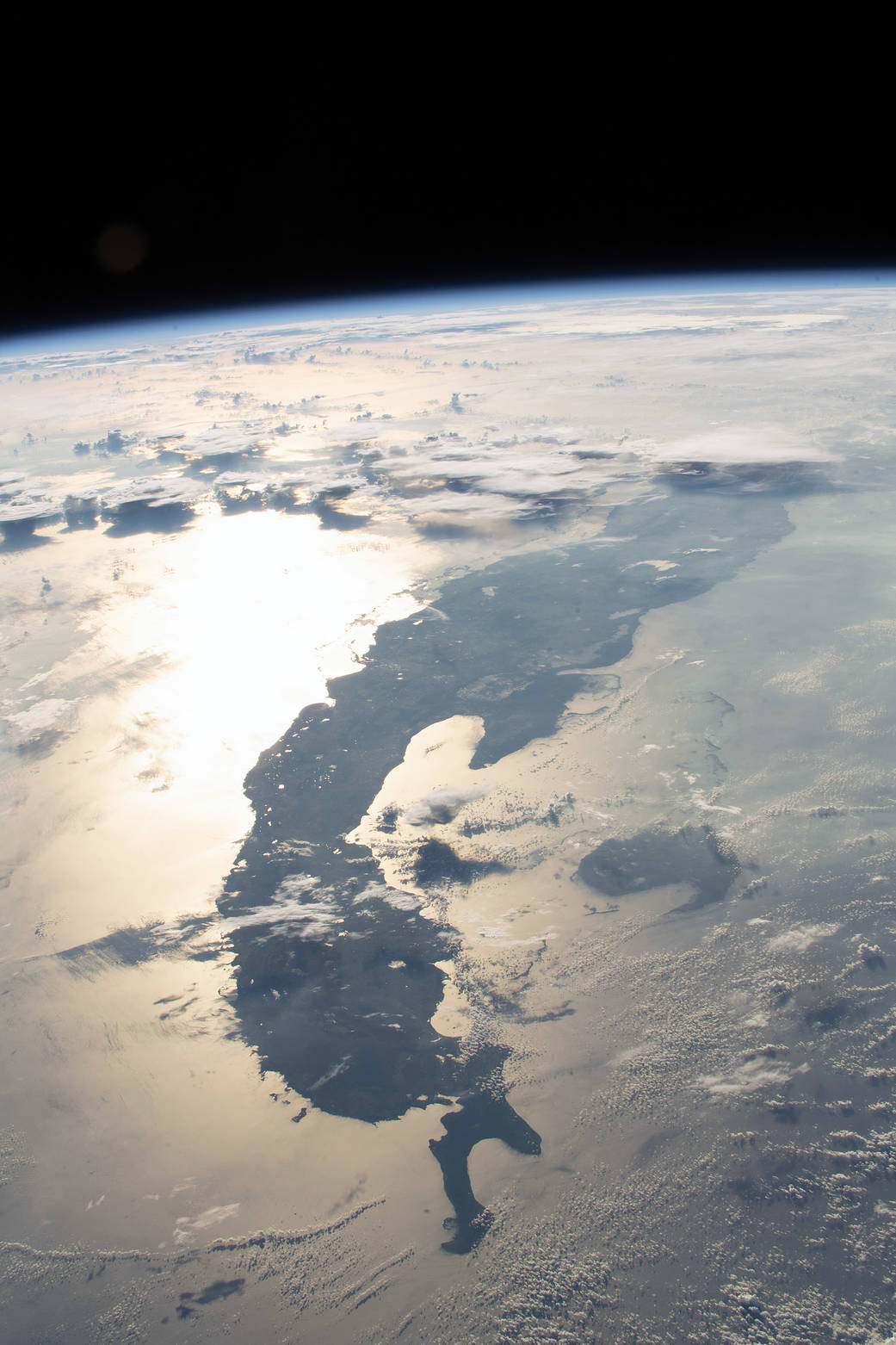 Sunglint and thunderclouds over Cuba seen from low Earth orbit