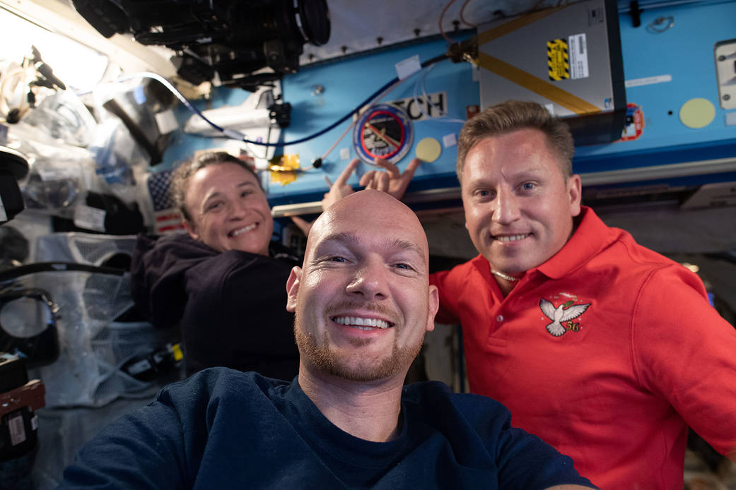 Expedition 56-57 crewmates pose for a portrait