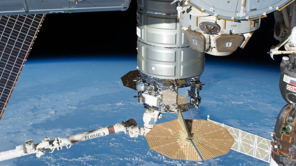 The Cygnus space freighter is grappled by the Canadarm2