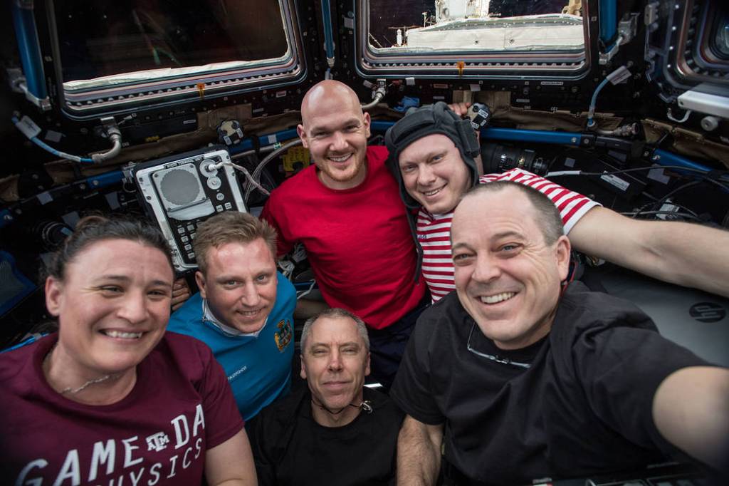 The entire six-member Expedition 56 crew gathers in the Cupola