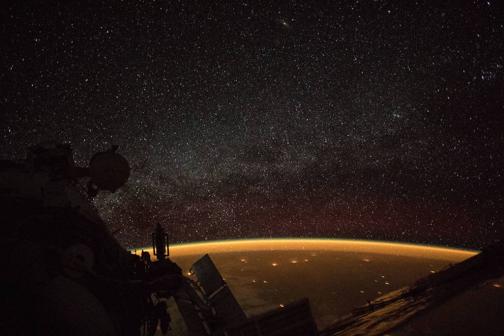 Celestial view of Earth’s atmospheric glow and the Milky Way
