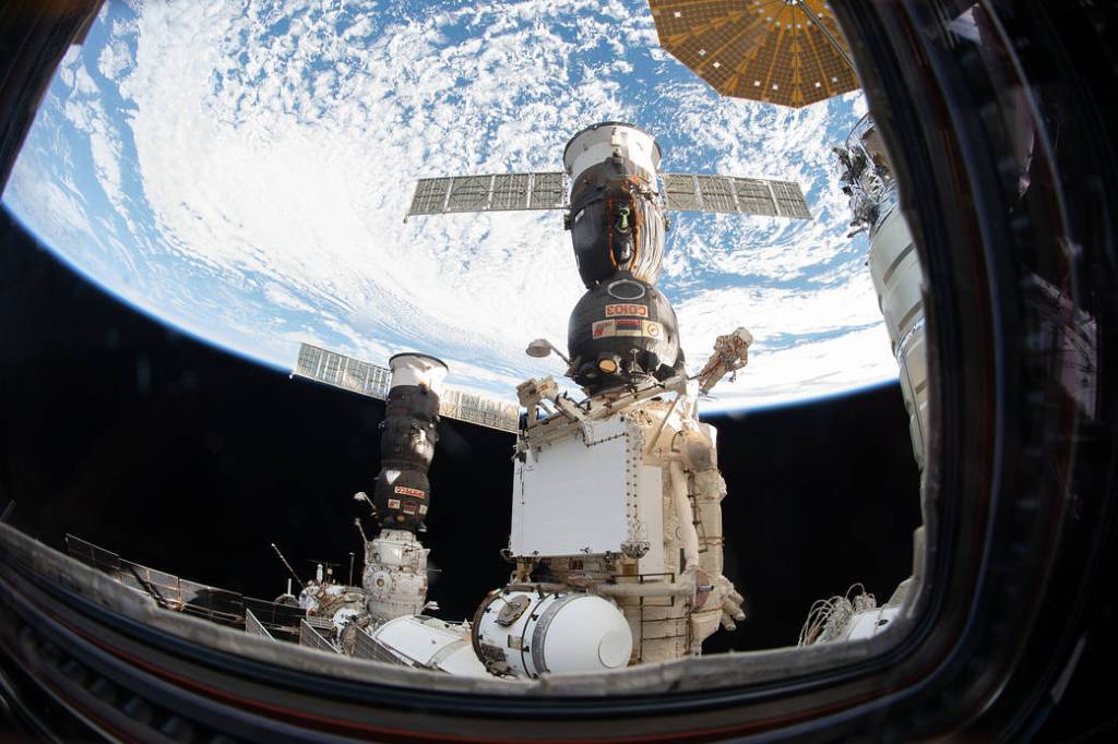 Russian spacewalker Oleg Kononenko attached to the Strela boom
