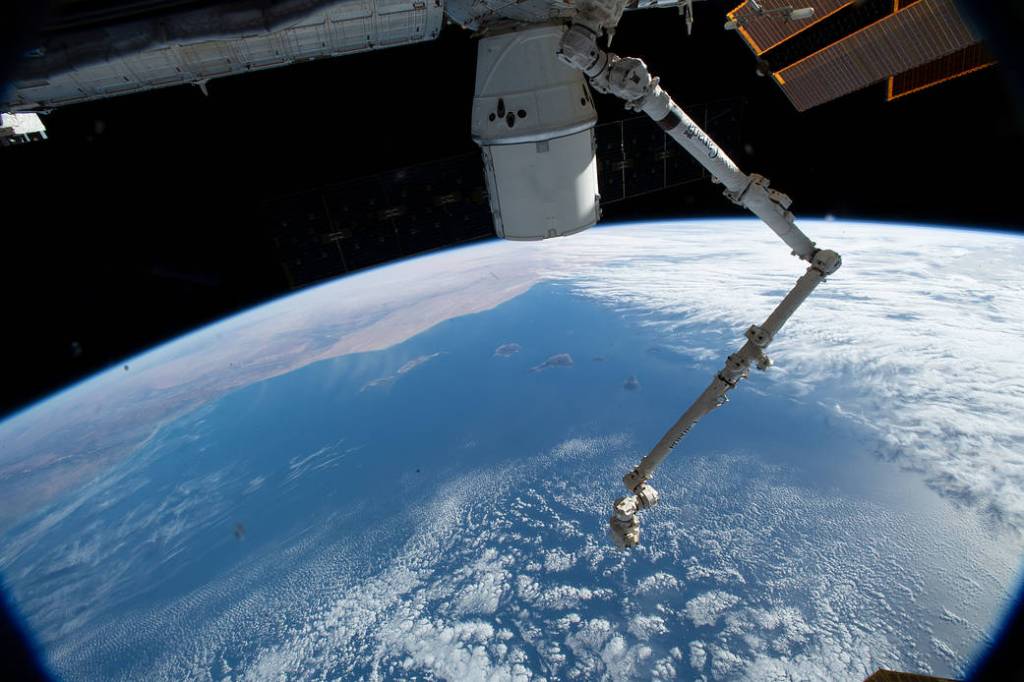 The SpaceX Dragon cargo craft and the Canadarm2 robotic arm