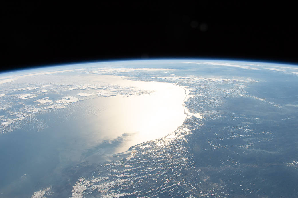The Sun's glint reflects off the Gulf of Mexico