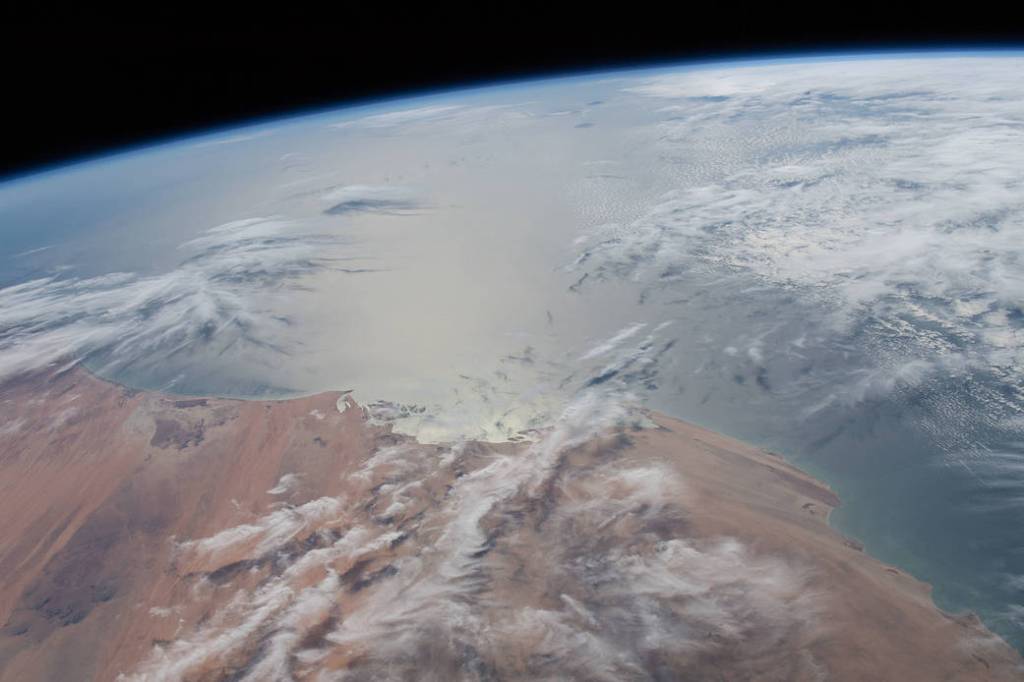 The Sun’s glint radiates off the Atlantic Ocean