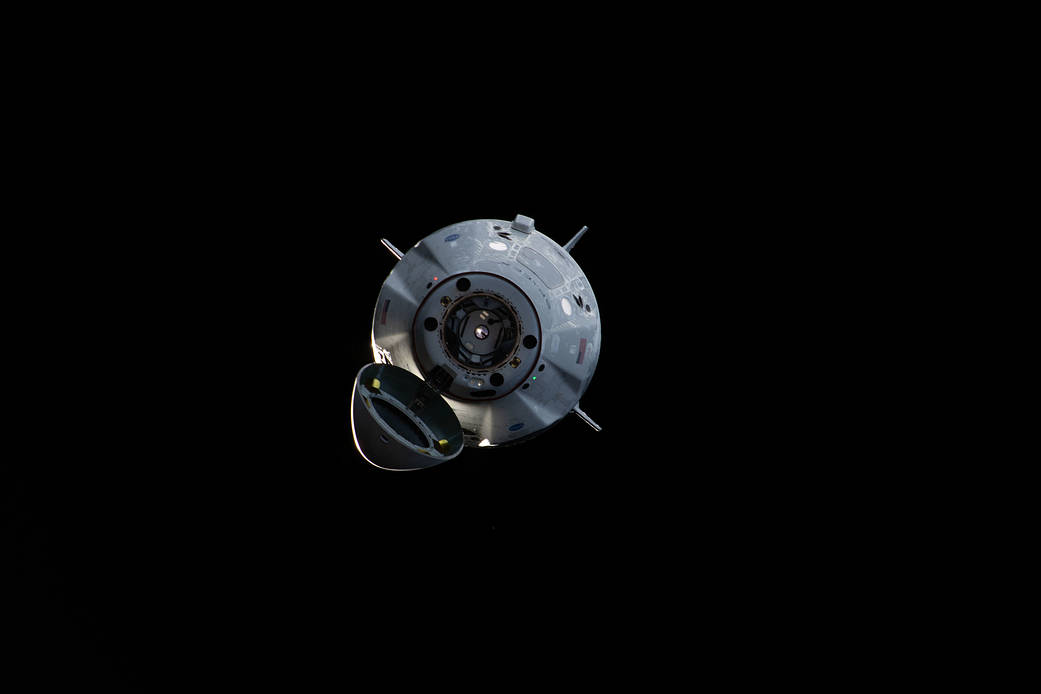 The uncrewed SpaceX Crew Dragon spacecraft on approach to the station's Harmony module