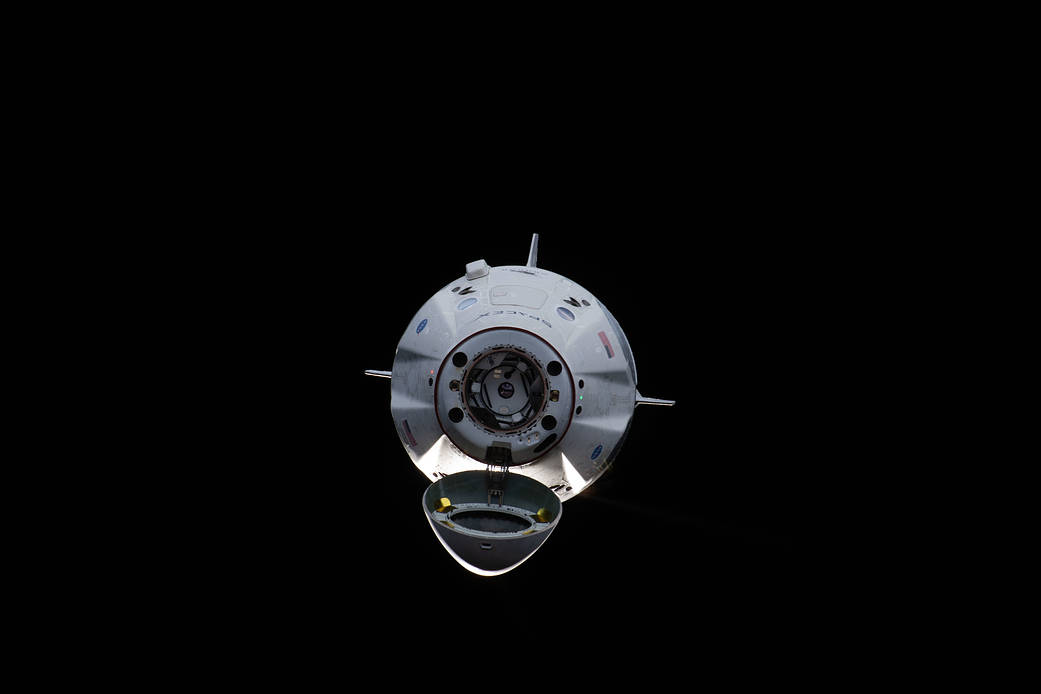 The uncrewed SpaceX Crew Dragon spacecraft on approach to the station's Harmony module