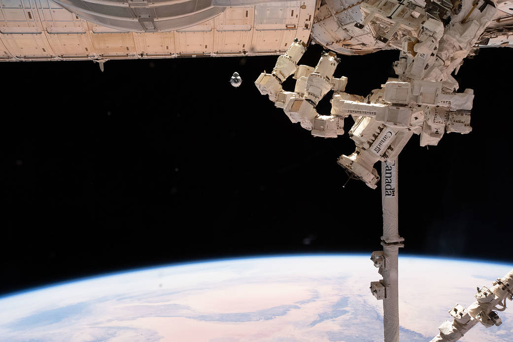 The uncrewed SpaceX Crew Dragon spacecraft on approach to the station's Harmony module
