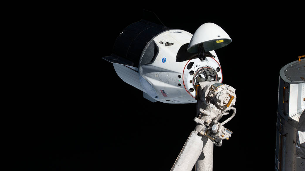 The uncrewed SpaceX Crew Dragon spacecraft on approach to the station's Harmony module