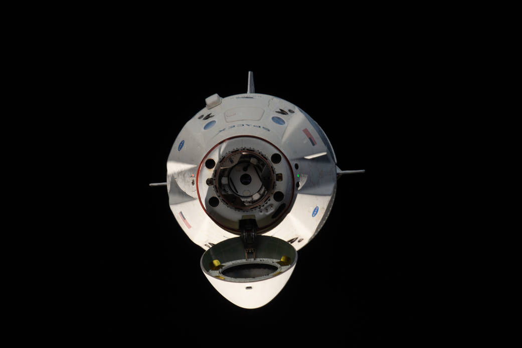 The uncrewed SpaceX Crew Dragon spacecraft on approach to the station's Harmony module