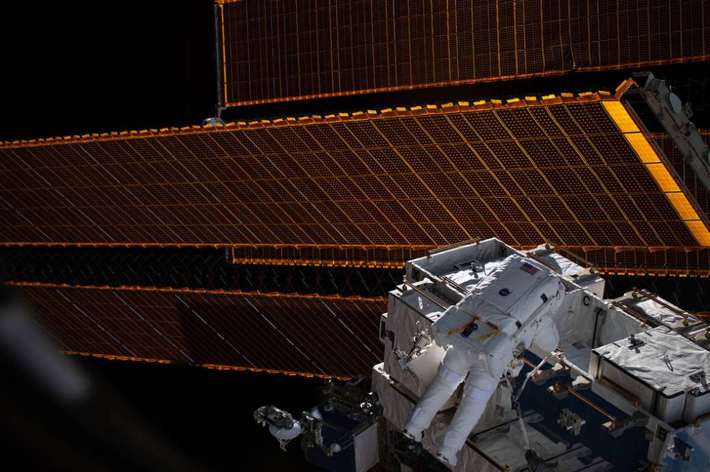 Spacewalker Nick Hague retrieves batteries and adapter plates