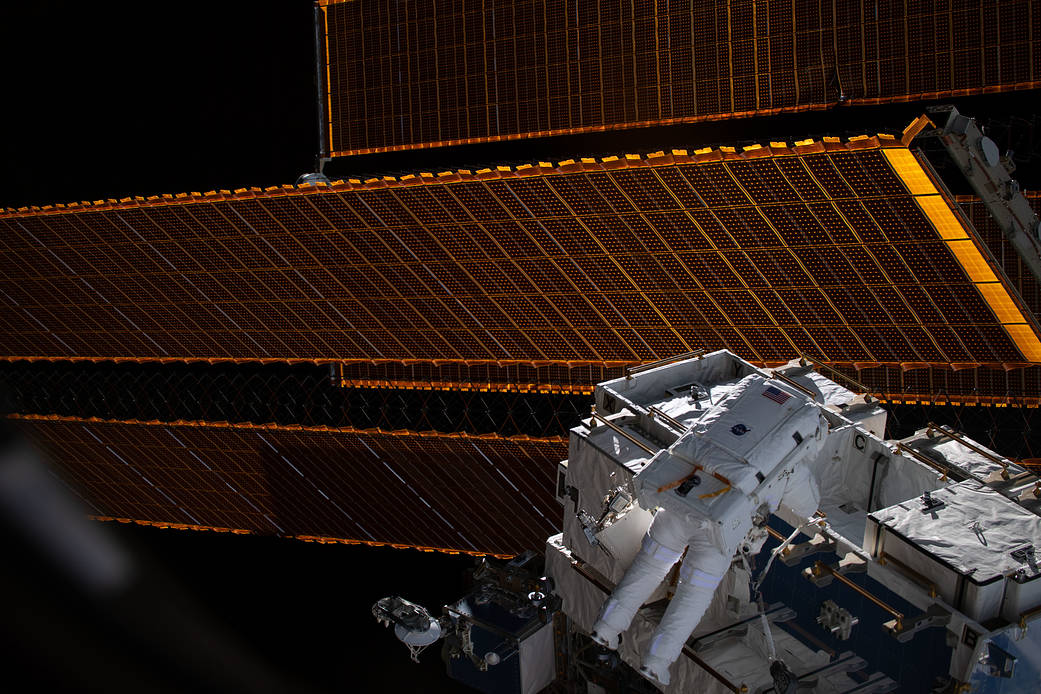Spacewalker Nick Hague retrieves batteries and adapter plates