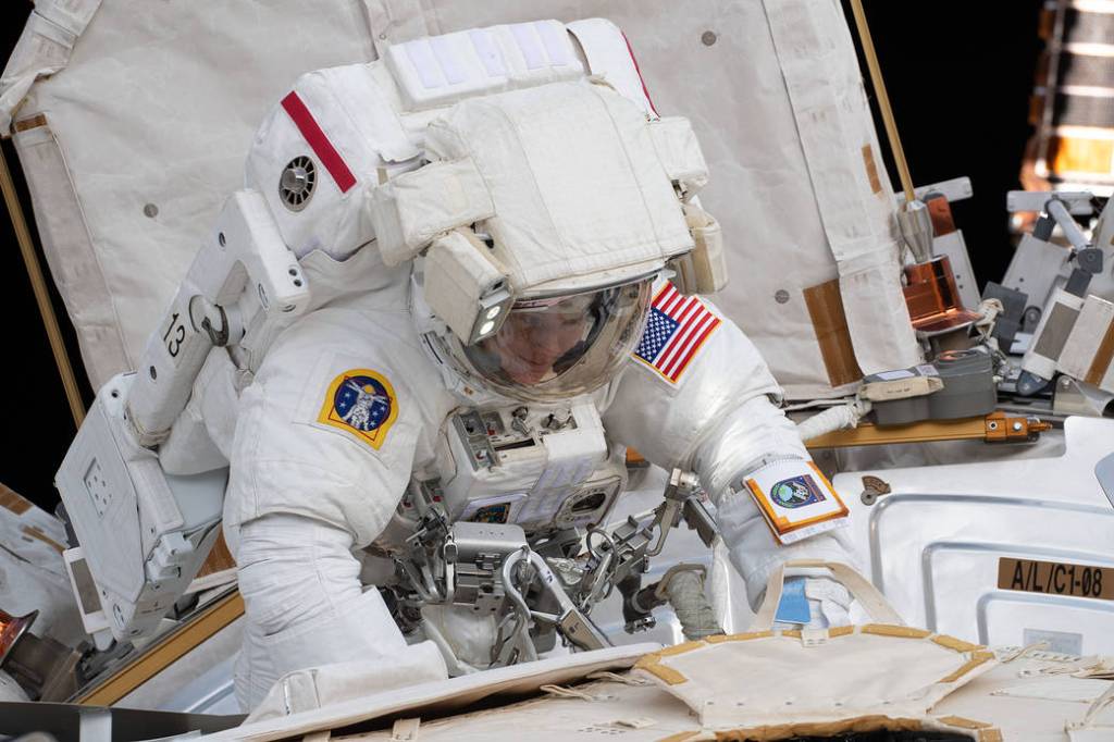 Spacewalker Anne McClain works outside the U.S. Quest airlock
