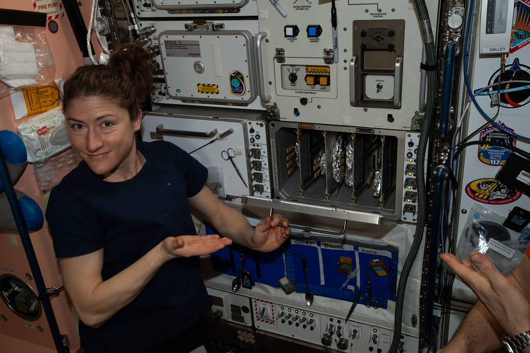 NASA astronaut Christina Koch waits for pizza