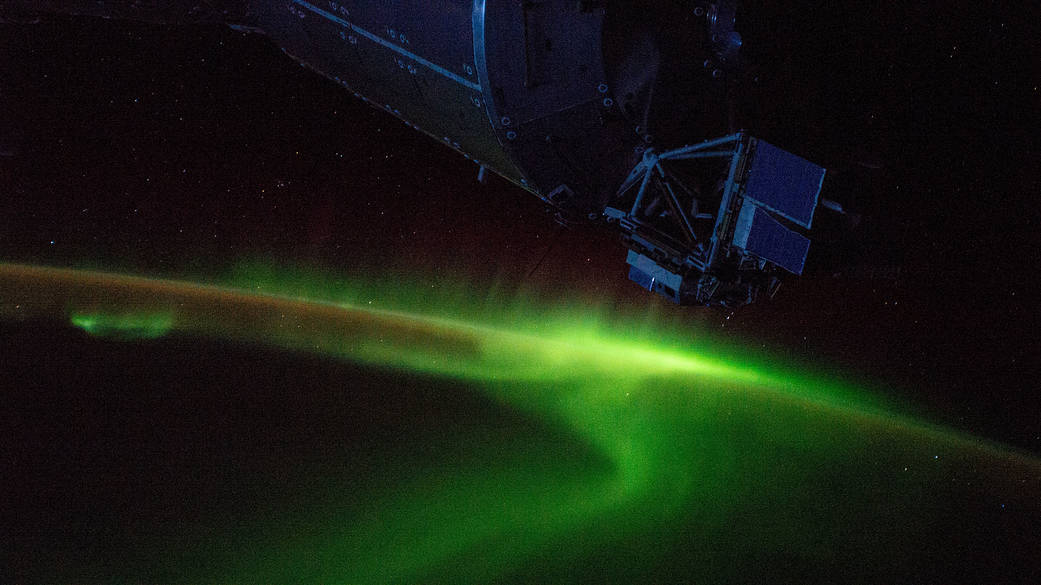 The aurora australis swirls above the Indian Ocean south of Australia