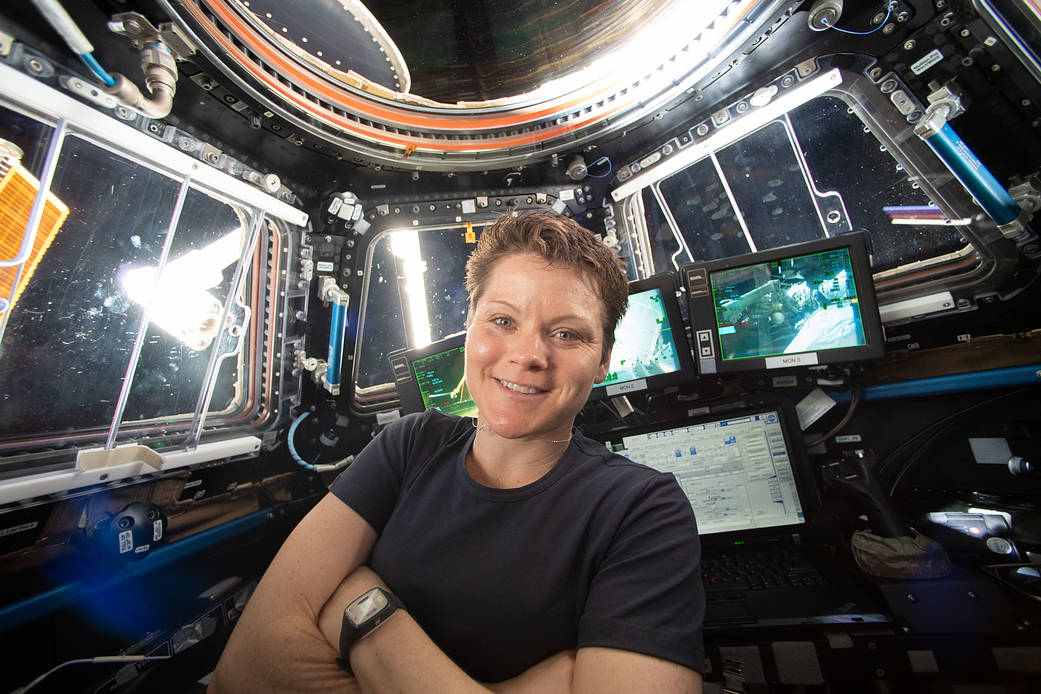 Astronaut Anne McClain takes a portrait inside the cupola
