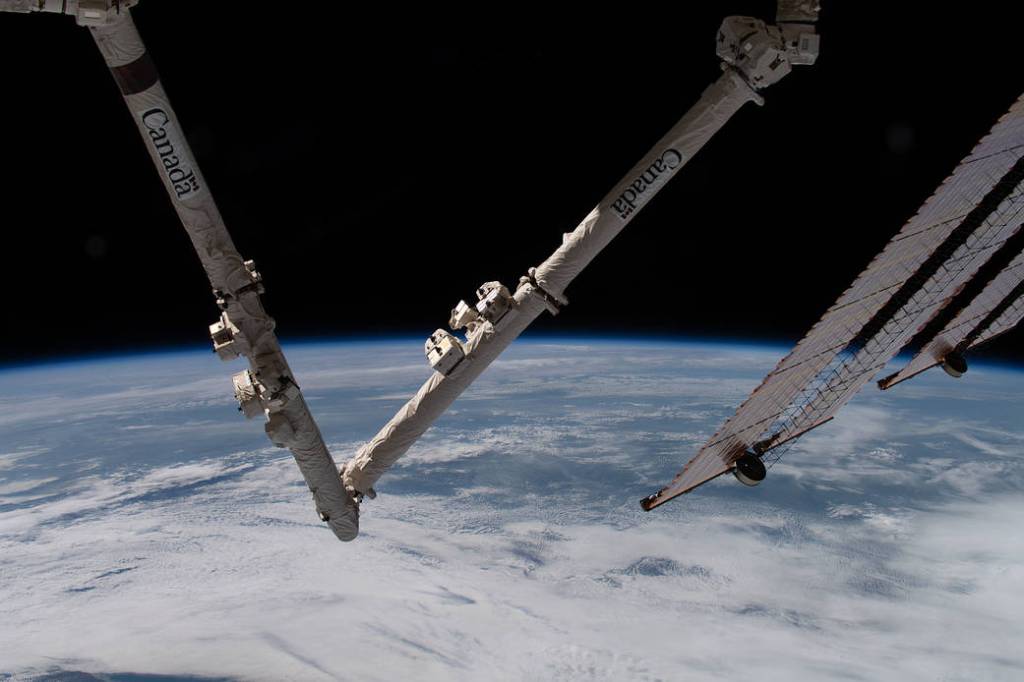 The Earth’s limb and portions of the Canadarm2 and solar arrays