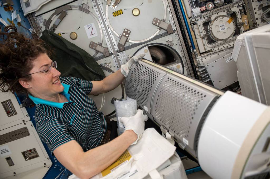 NASA astronaut Christina Koch stows frozen science samples