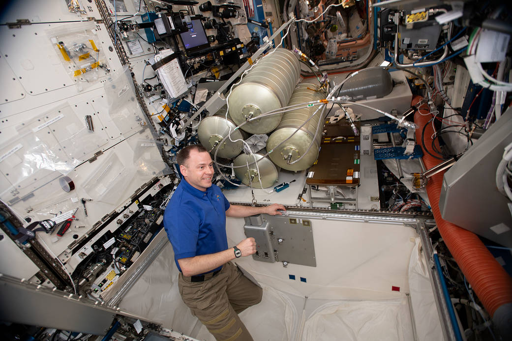 NASA astronaut Nick Hague assembles and installs the Water Storage System