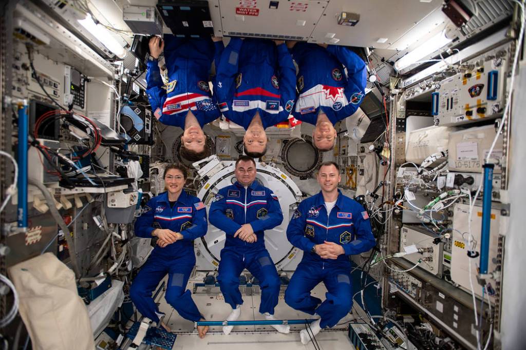 The six-member Expedition 59 crew gathers for a portrait