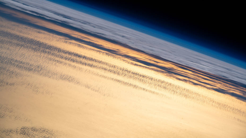 Flying into an orbital sunset above the Pacific Ocean