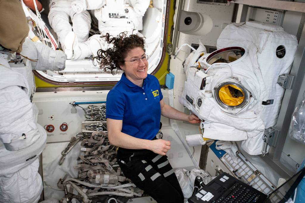 Christina Koch of NASA works on a U.S. spacesuit
