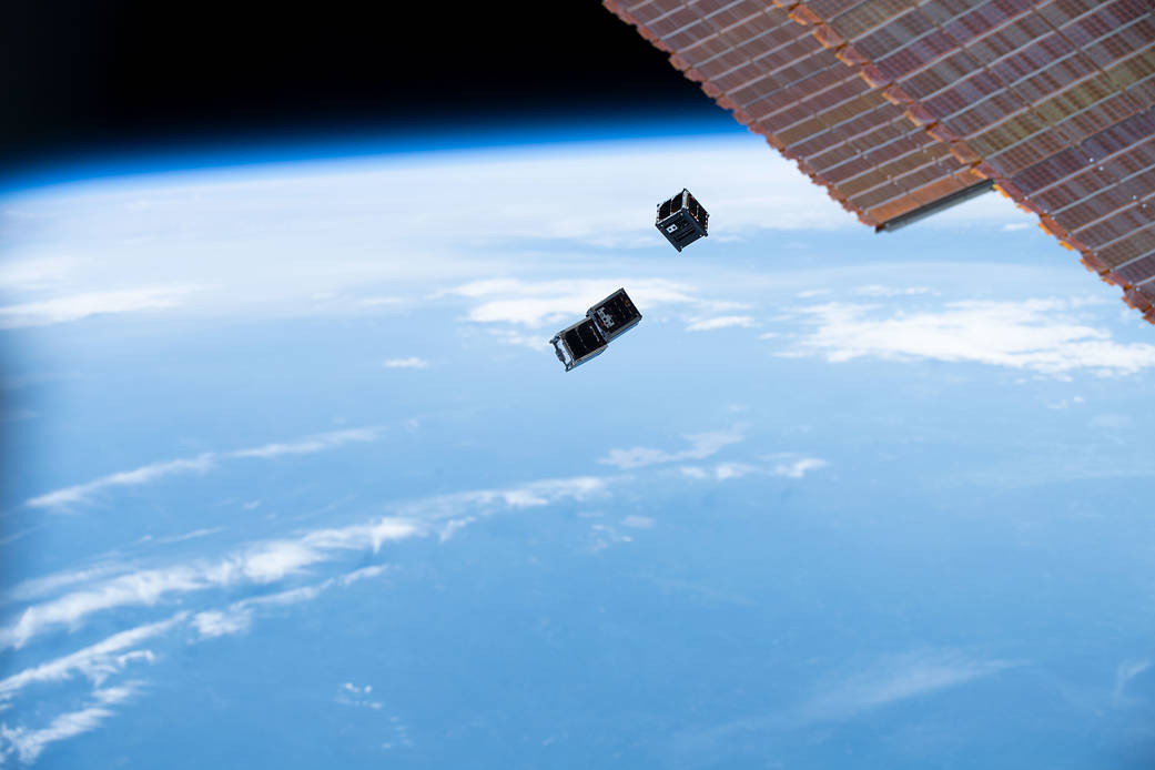 The three Virginia CubeSat Constellation satellites deploy from the International Space Station.