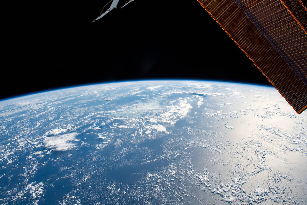 The Sun's glint beams off the blue waters of the Pacific Ocean