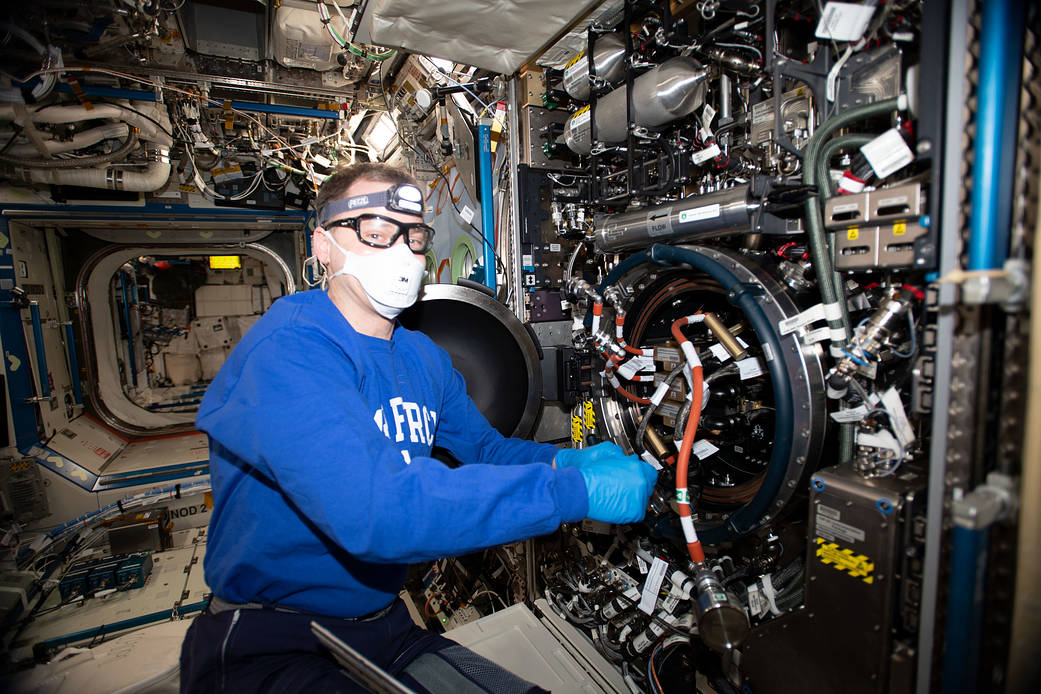 Flight Engineer Nick Hague services the Combustion Integrated Rack