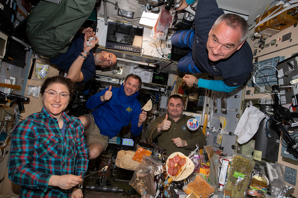 It's dinner time aboard the International Space Station