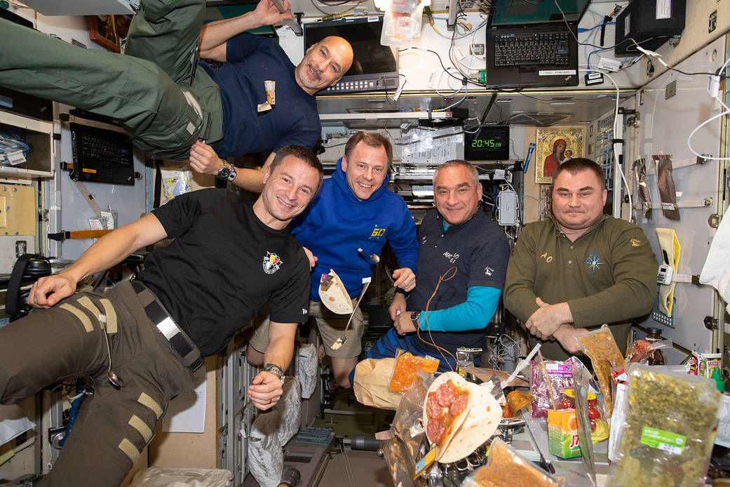 It's dinner time aboard the International Space Station
