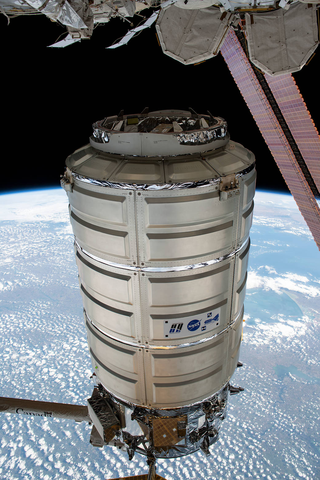 The Cygnus space freighter in the grips of the Canadarm2