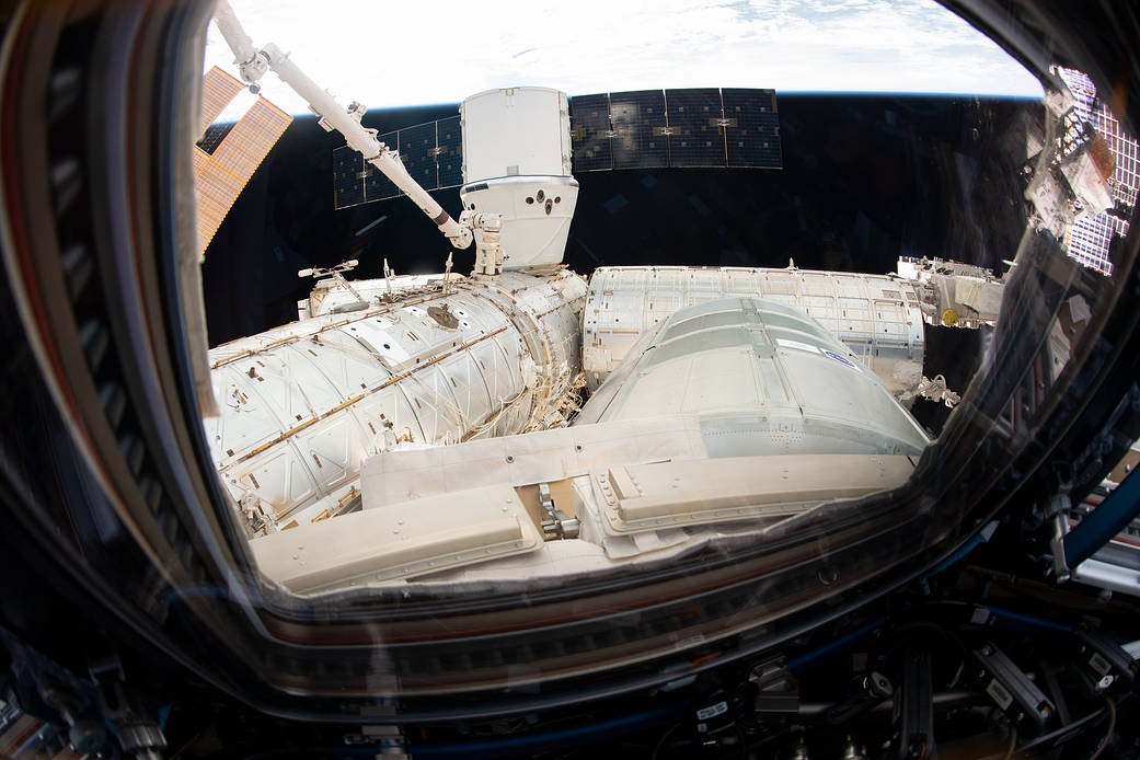 The SpaceX Dragon resupply ship is pictured attached to the space station's Harmony module 