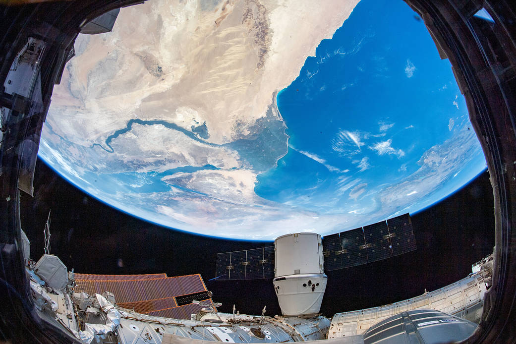 The space station flies above the Nile River Delta in Egypt with the SpaceX Dragon resupply ship attached