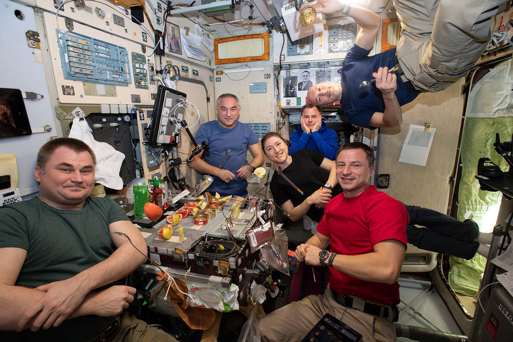 The Expedition 60 crew is gathered together for dinner