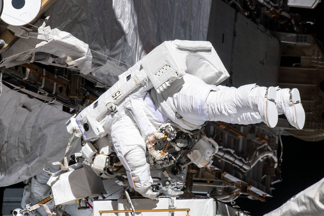 NASA astronaut Christina Koch works while tethered near the Port 6 truss