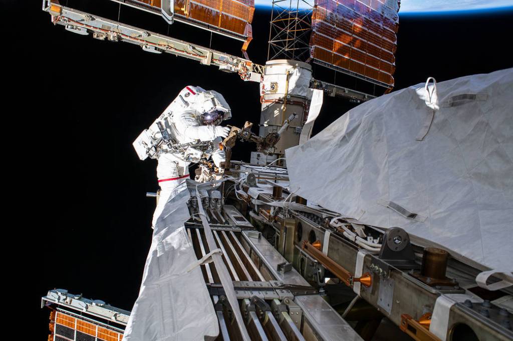 NASA astronaut Andrew Morgan works while tethered on the Port 6 truss