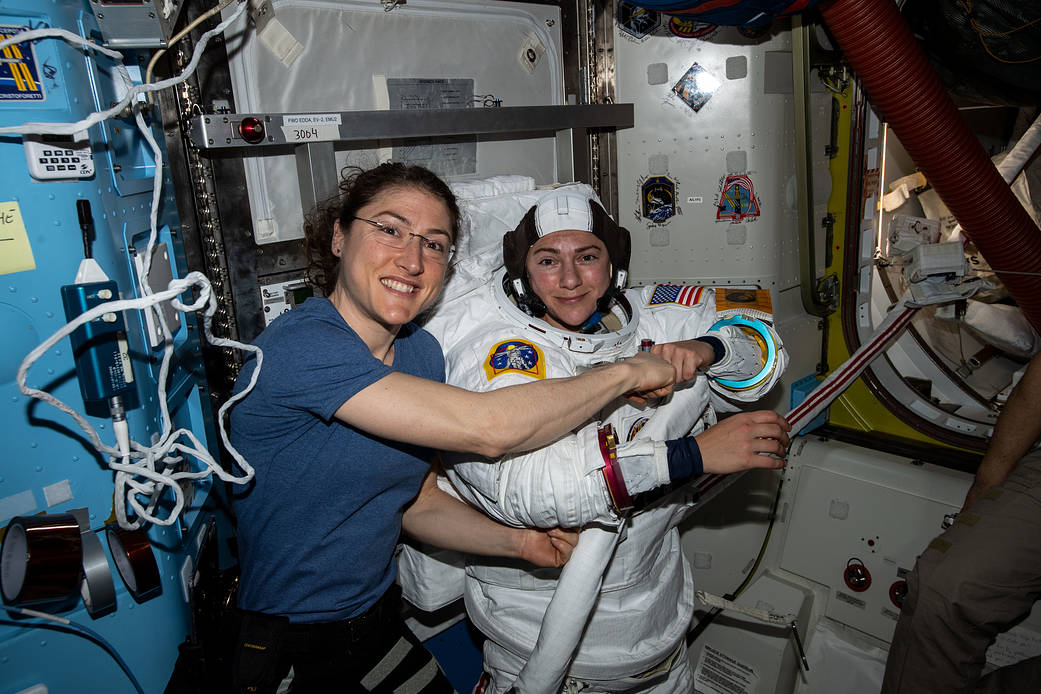 NASA astronauts Christina Koch and Jessica Meir prepare for a spacewalk