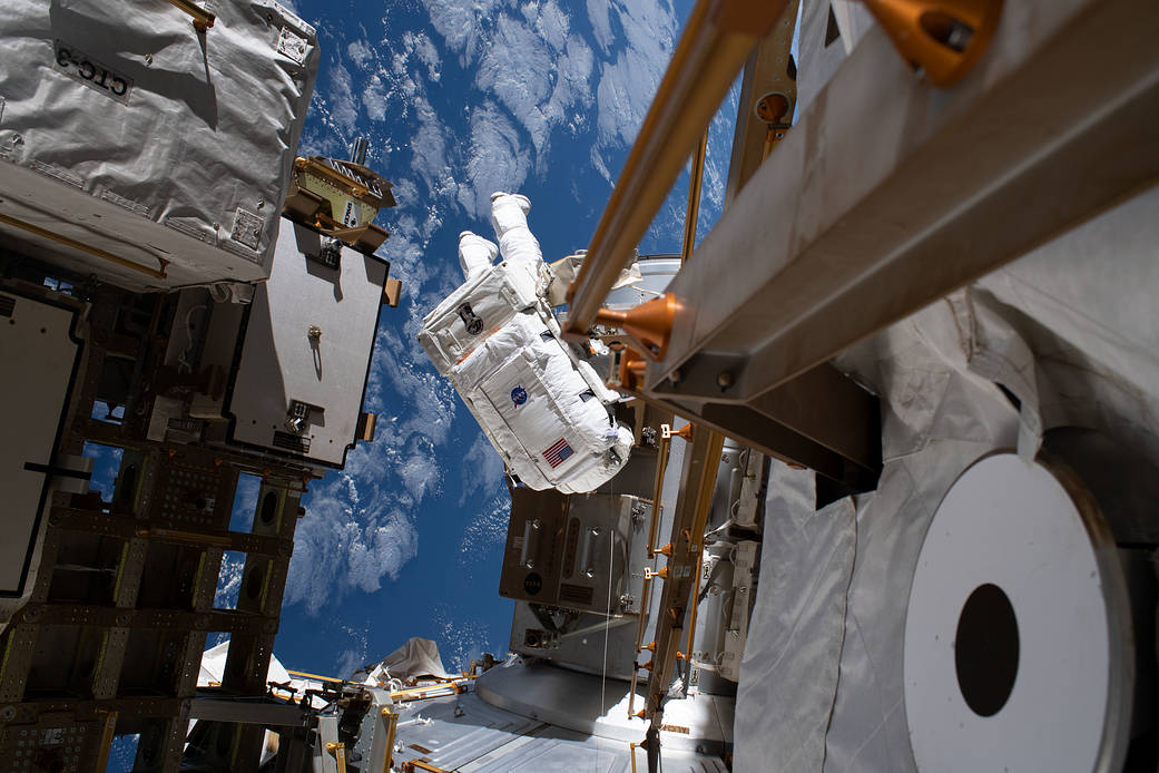 Astronaut Jessica Meir is pictured tethered to the outside of the station