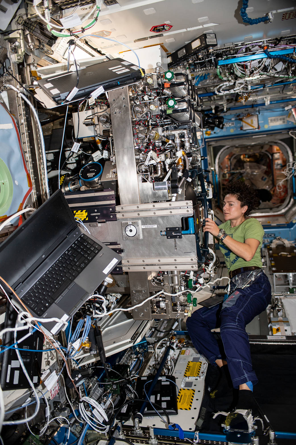 NASA astronaut Jessica Meir works on the Combustion Integrated Rack