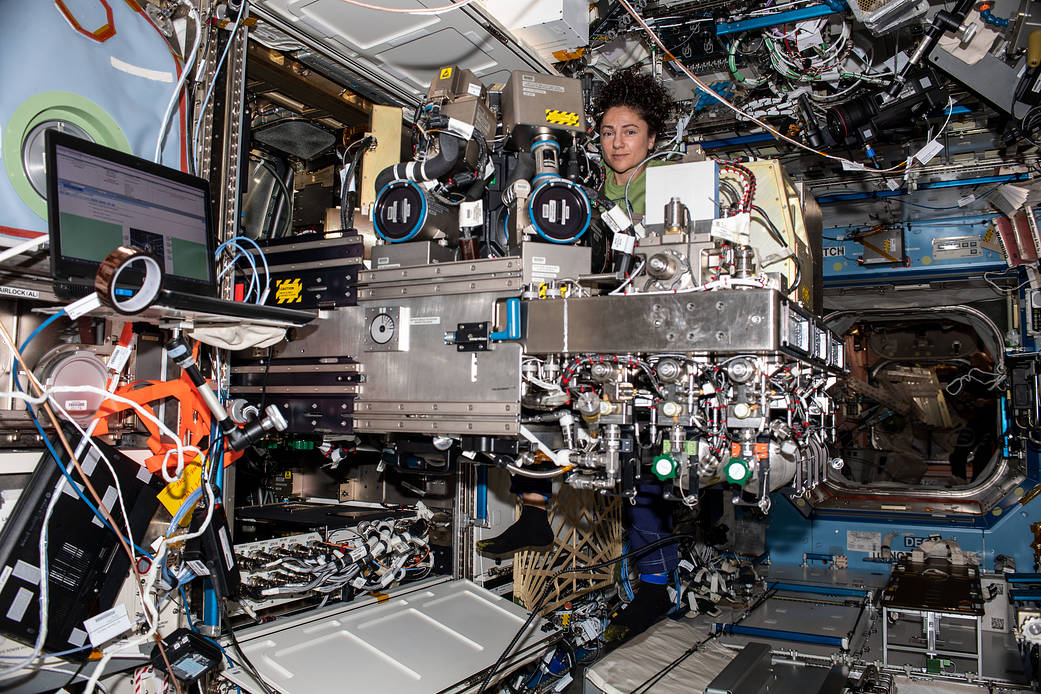 NASA astronaut Jessica Meir works on the Combustion Integrated Rack