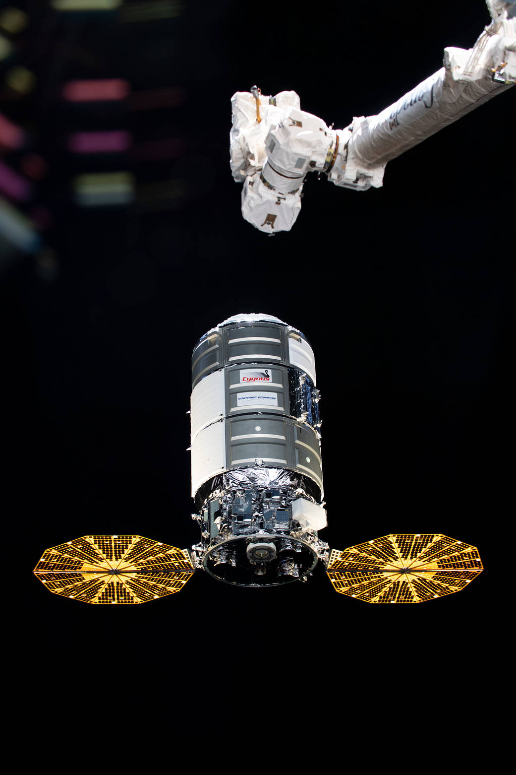 The Cygnus space freighter approaches the space station