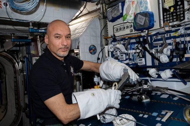 ESA astronaut Luca Parmitano tests specialized spacewalking tools