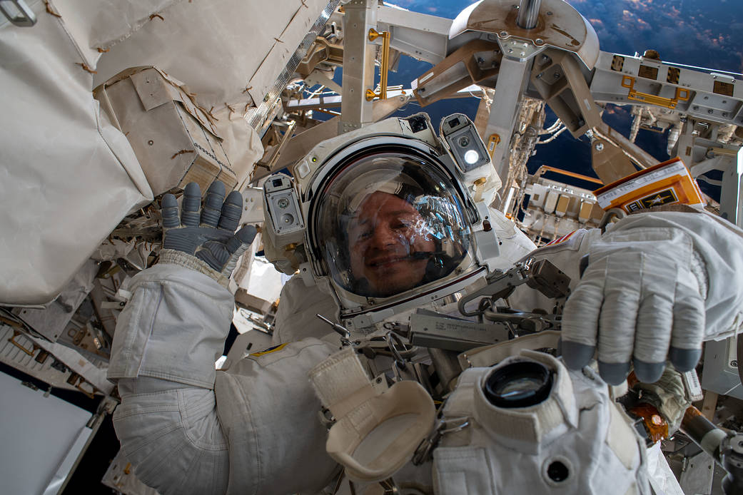 NASA astronaut Andrew Morgan waves during a spacewalk
