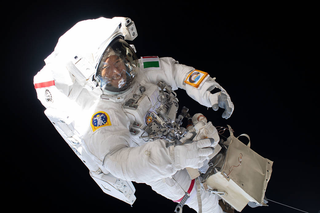 Spacewalker Luca Parmitano rides the Canadarm2 robotic arm